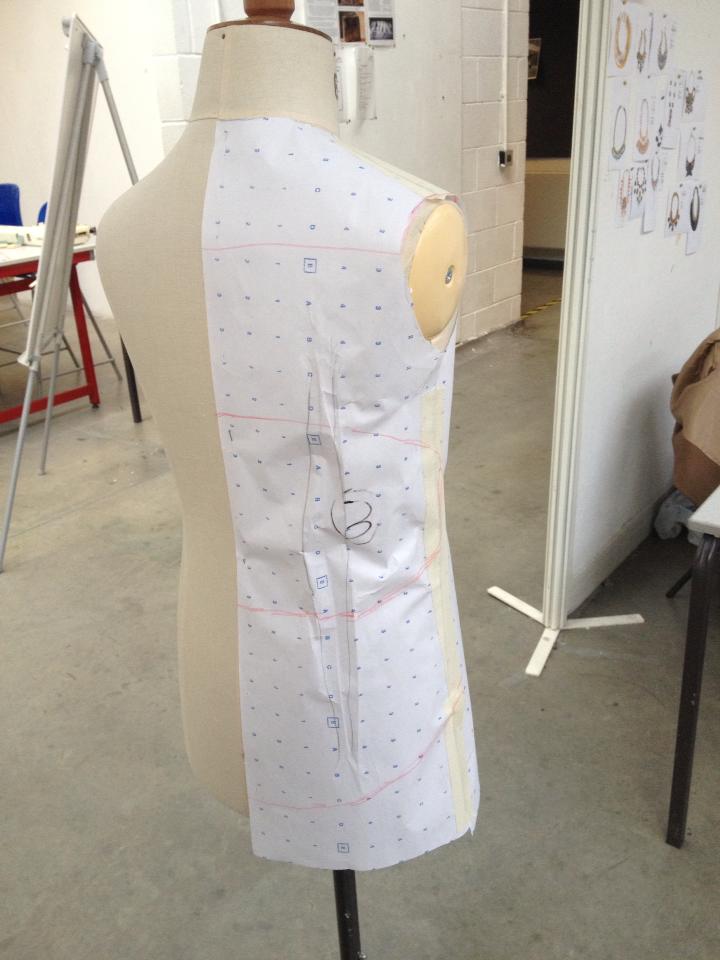 With the pattern attached to the mannequin I drew the shapes I wanted straight on, 